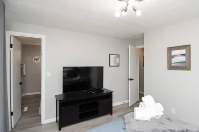 a living room with a flat screen tv and a couch at Sunny Ranch - Newly Remodeled in Dayton