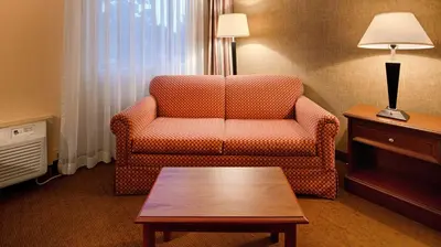 a living room with a couch and a coffee table at Baymont Inn & Suites in Marietta