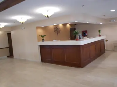 a waiting area in a hospital with a large mirror at Royalton Inn and Suites, Wilmington,Ohio in Wilmington