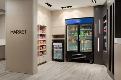 a walk in cooler in a store with drinks in it at TownePlace Suites by Marriott Cincinnati Oakley in Cincinnati