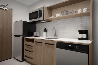 a kitchen with a sink and a refrigerator at Home2 Suites By Hilton Columbus Easton in Columbus