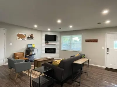 a living room with a couch and a tv at Spacious 3-bedroom home in Archbold in Archbold
