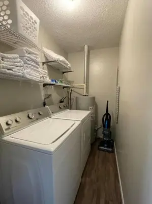 a small laundry room with a washer and dryer at Spacious 3-bedroom home in Archbold in Archbold