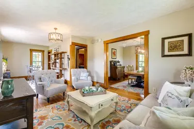 a living room with a couch and a table at Countryside Home in Wooster with Patio and Fire Pit in Wooster