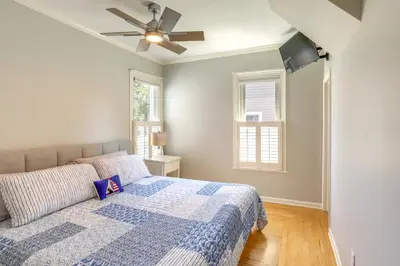 a bedroom with a bed and a ceiling fan at Vermilion Home - Walk to Main Street Beach! in Vermilion
