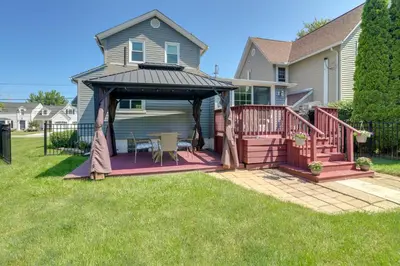 a deck with a gazebo in the yard of a house at Vermilion Home - Walk to Main Street Beach! in Vermilion