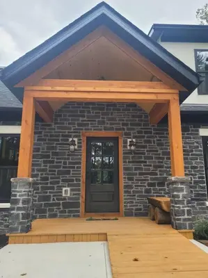 a front porch of a house with a door at The Saige - Hot Tub, Fire Pit, and huge entertainment area in Logan