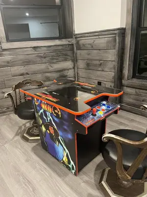 a ping pong table in the corner of a room at The Quana - Hot tub, fire pit, and Huge Entertainment Area in Logan
