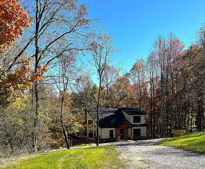 a small house on the side of a road at The Quana - Hot tub, fire pit, and Huge Entertainment Area in Logan