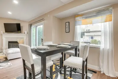 a dining room with a black table and chairs at 8 Mi to Downtown Pet-Friendly Columbus Home in Columbus
