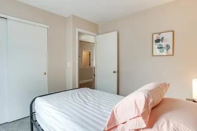 a bedroom with white walls and a bed at 8 Mi to Downtown Pet-Friendly Columbus Home in Columbus