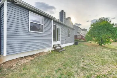 a gray house with a window and a yard at 8 Mi to Downtown Pet-Friendly Columbus Home in Columbus