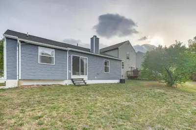 a house with a large yard in front of it at 8 Mi to Downtown Pet-Friendly Columbus Home in Columbus