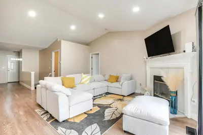 a living room with two white couches and a fireplace at 8 Mi to Downtown Pet-Friendly Columbus Home in Columbus