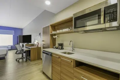 a kitchen with a sink and a microwave at Home2 Suites By Hilton Cincinnati Midtown Oakley in Cincinnati
