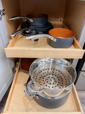 a drawer filled with pots and pans in a kitchen at 4BR-Beautiful Historic Home in Millersburg