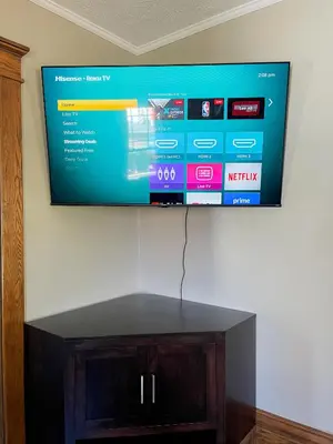 a flat screen tv hanging on a wall at 4BR-Beautiful Historic Home in Millersburg