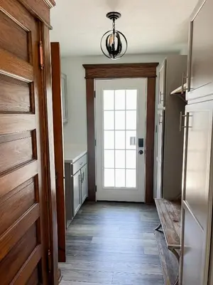 a hallway with a door leading to a kitchen at 4BR-Beautiful Historic Home in Millersburg