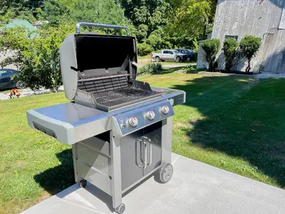 a barbecue grill sitting on top of a lawn at 4BR-Beautiful Historic Home in Millersburg
