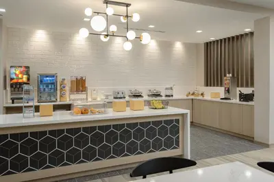 a lobby with a counter and aasteryasteryasteryasteryasteryasteryasteryasteryastery at Fairfield by Marriott Inn & Suites Cincinnati Oakley in Cincinnati