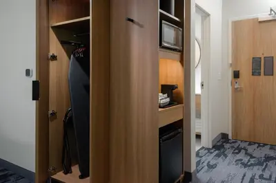 a closet with a door open to a room at Fairfield by Marriott Inn & Suites Cincinnati Oakley in Cincinnati