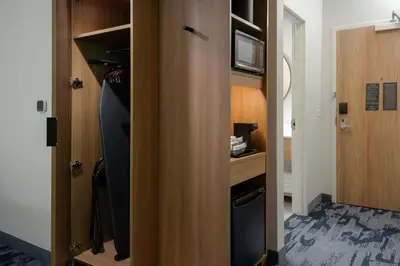 a closet with a door open to a room at Fairfield by Marriott Inn & Suites Cincinnati Oakley in Cincinnati