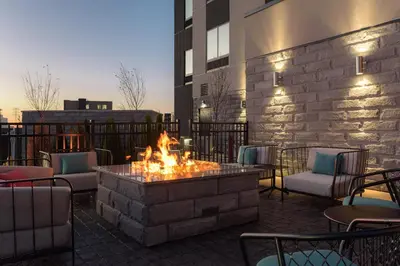 a fire pit in the middle of a patio at Fairfield by Marriott Inn & Suites Cincinnati Oakley in Cincinnati