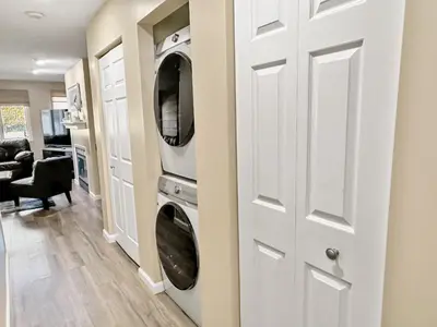 a laundry room with two washer and dryer at On Island Time at Kelleys Island Condo! in Kelleys Island