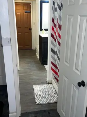 a hallway with an american flag on the door at The Cozy Corner in Toledo