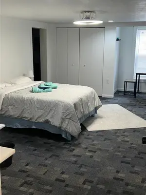 a bedroom with a large bed in a room at The Cozy Corner in Toledo