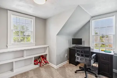 an attic office with a desk and a chair at Near CLE Clinic UH & Case Western in Shaker Heights