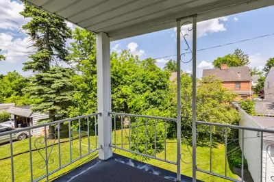 a balcony with a view of a yard at Near CLE Clinic UH & Case Western in Shaker Heights