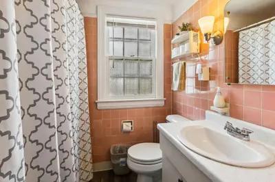 a bathroom with a toilet and a sink at Near CLE Clinic UH & Case Western in Shaker Heights