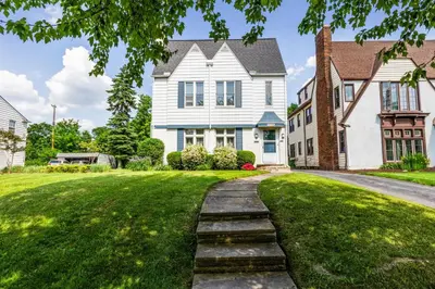 a house with a stone path in front of a yard at Near CLE Clinic UH & Case Western in Shaker Heights