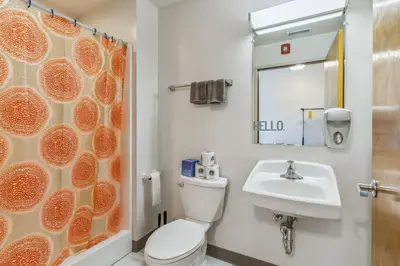 a bathroom with a toilet and a sink at The Victor 2 - Cleveland's Urban Lodge in Cleveland