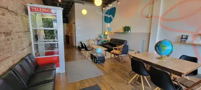 a room with a table and chairs and a living room at The Victor 3 - Cleveland's Urban Lodge in Cleveland