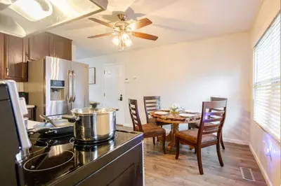 a kitchen and dining room with a dining table at Private Ranch - Entire Home - 3 Bed Room - Hot Tub - King Bed - Fenced Yard - Pets & Kids Welcome - Game Shed - Free WiFi in Columbus