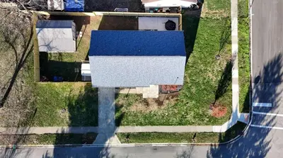 an overhead view of a house with a blue roof at Private Ranch - Entire Home - 3 Bed Room - Hot Tub - King Bed - Fenced Yard - Pets & Kids Welcome - Game Shed - Free WiFi in Columbus