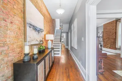 a hallway of a home with a brick wall at The Beer Baron House - Rhinegeist - FREE Streetcar in Cincinnati