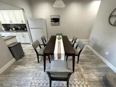 a dining room with a table and chairs in a kitchen at Charming 2BR Near Downtown & Attractions in Columbus
