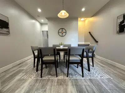 a dining room with a table and chairs at Charming 2BR Near Downtown & Attractions in Columbus