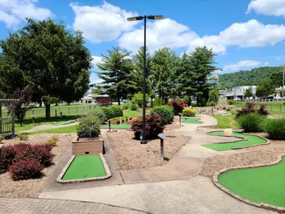a park with green golf courses and a light pole at Holiday Inn Express & Suites New Martinsville by IHG in New Martinsville