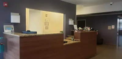 an office with a reception counter with a mirror at Quality Inn & Suites Caldwell I-77 in Caldwell