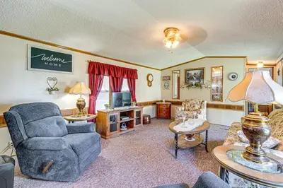 a living room with a couch and a chair at Paden City Home Near Ohio River! in New Martinsville