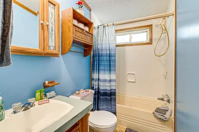 a bathroom with a sink and a toilet at Paden City Home Near Ohio River! in New Martinsville