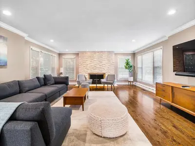 a living room with a couch and a table at Shaker Prestige - 4 000 sq ft - Calm and Quiet in Shaker Heights