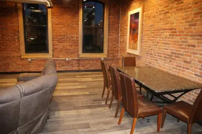 a dining room with a couch and a table and chairs at Downtown Cleveland Historic District in Cleveland