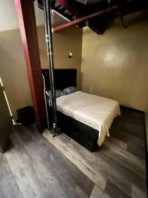 a room with a bed in the corner of a room at Downtown Cleveland Historic District in Cleveland