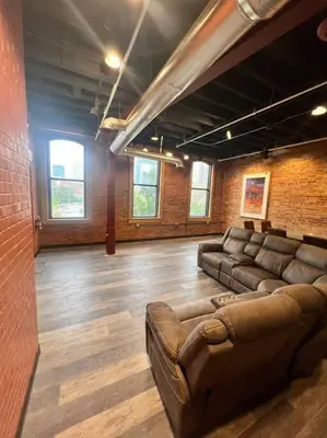 a large room with couches and a couch in it at Downtown Cleveland Historic District in Cleveland