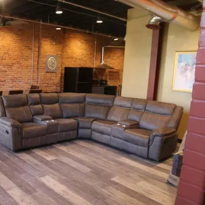 a large leather couch sitting in a room at Downtown Cleveland Historic District in Cleveland